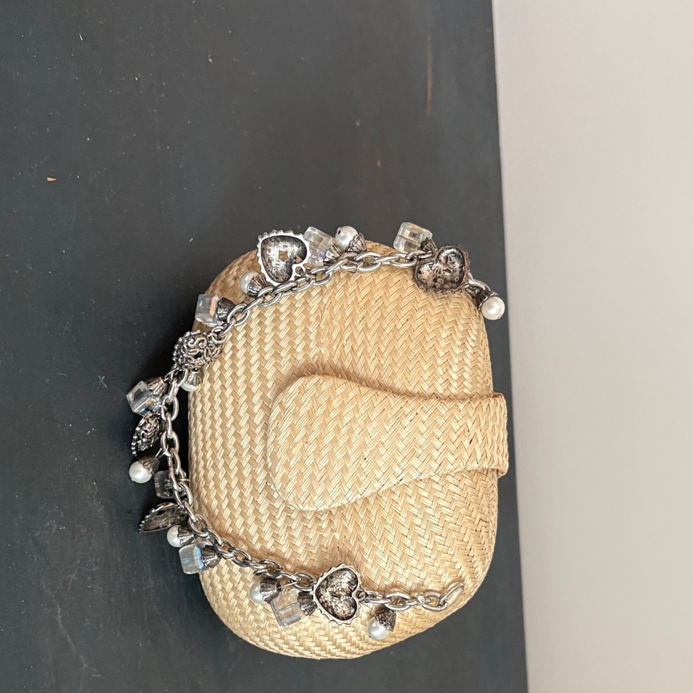 Woven Clutch with Silver Charm Bracelet handle.